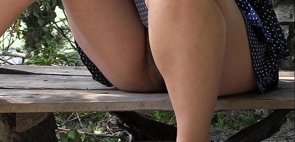  Voyeur peeps under a skirt outdoors. Hairy pussy and juicy ass in panties and without them. Fetish.